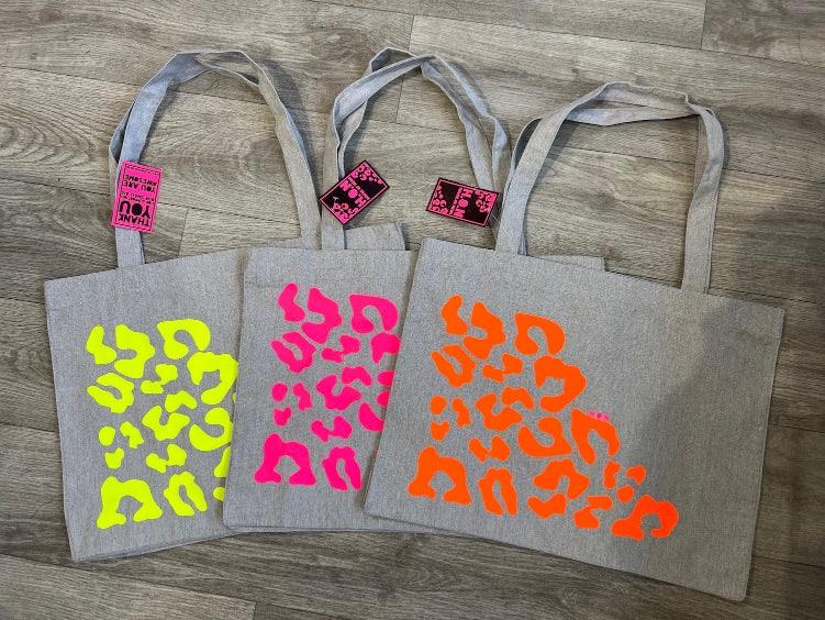 House of Neon Tote bags